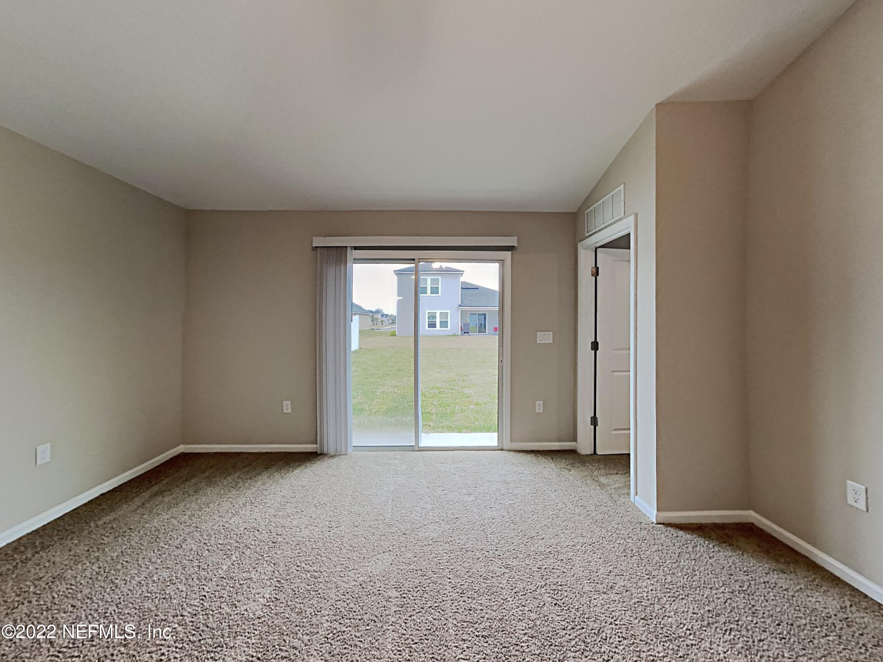 1562 Liberty Tree Place Jacksonville, FL 32221 - Photo 3 of 19 a view of an empty room with glass door
