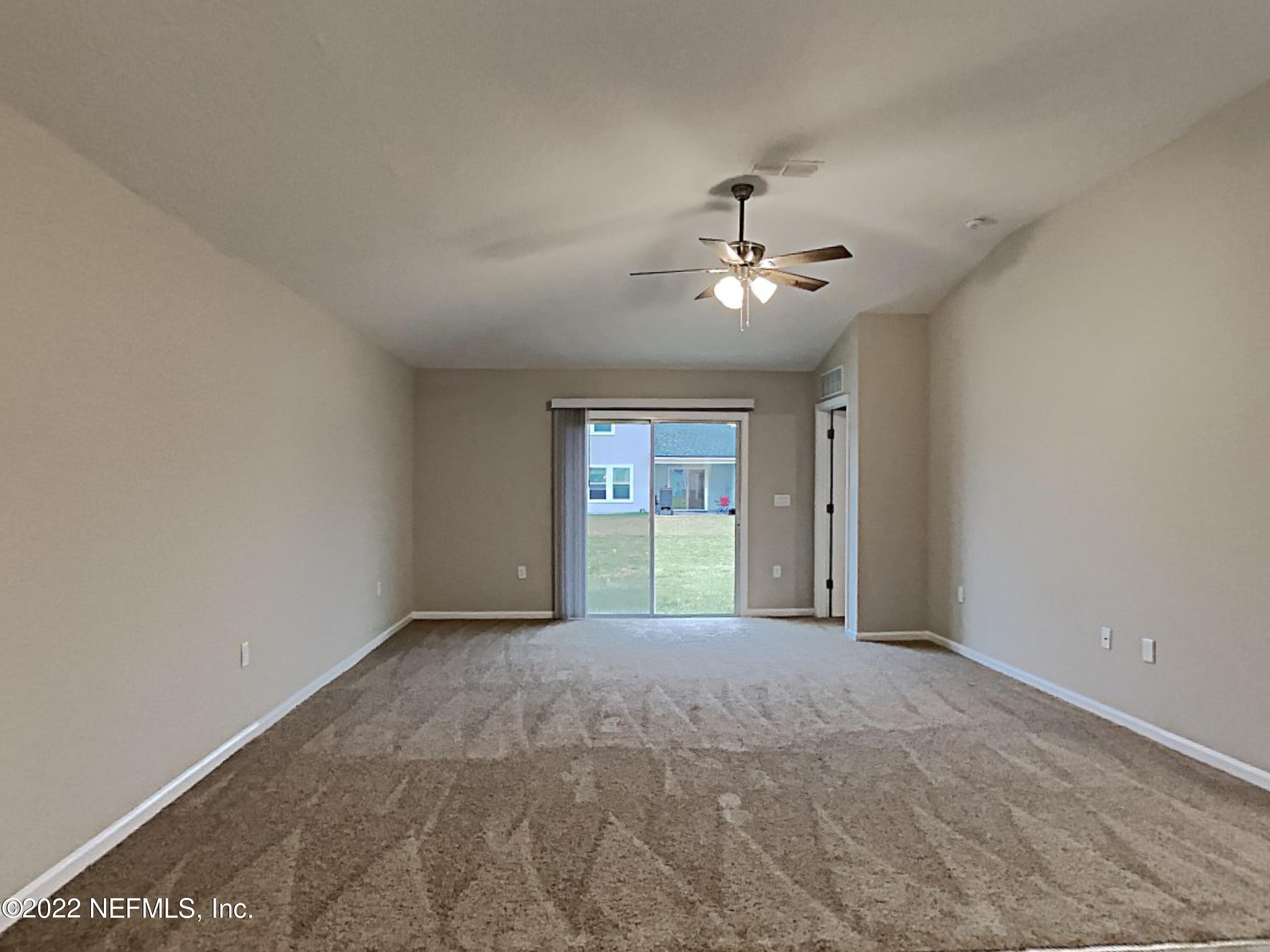 1562 Liberty Tree Place Jacksonville, FL 32221 - Photo 4 of 19 a view of an empty room with a window