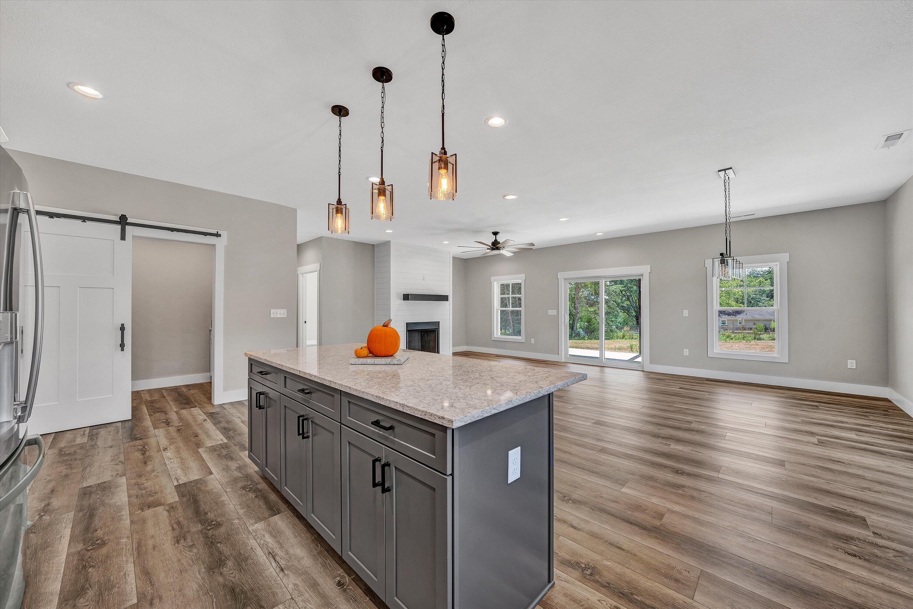 6450 Scruggs Road Moneta, VA 24121 - Photo 17 of 42 a kitchen with stainless steel appliances granite countertop a sink a refrigerator and a stove