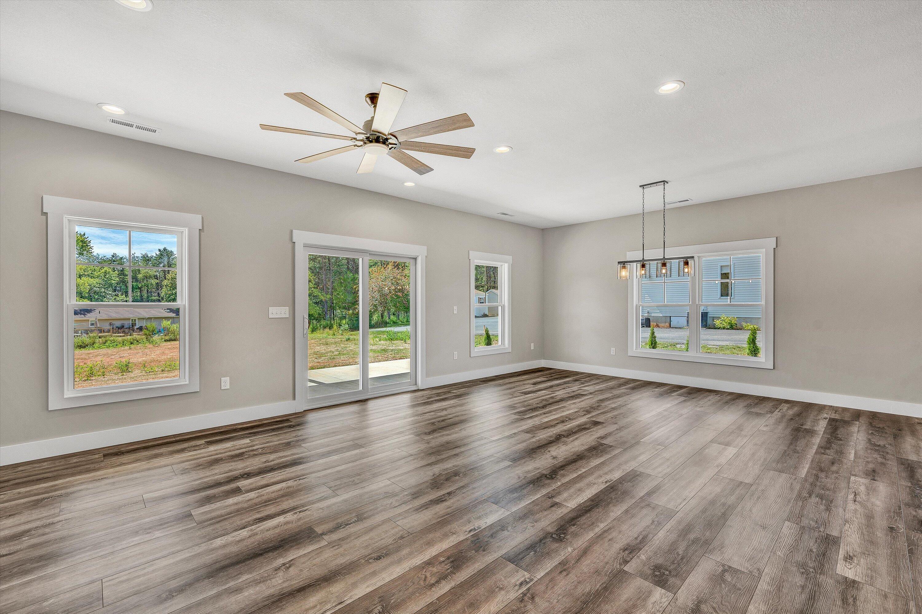 6450 Scruggs Road Moneta, VA 24121 - Photo 24 of 42 a view of an empty room with a window and wooden floor