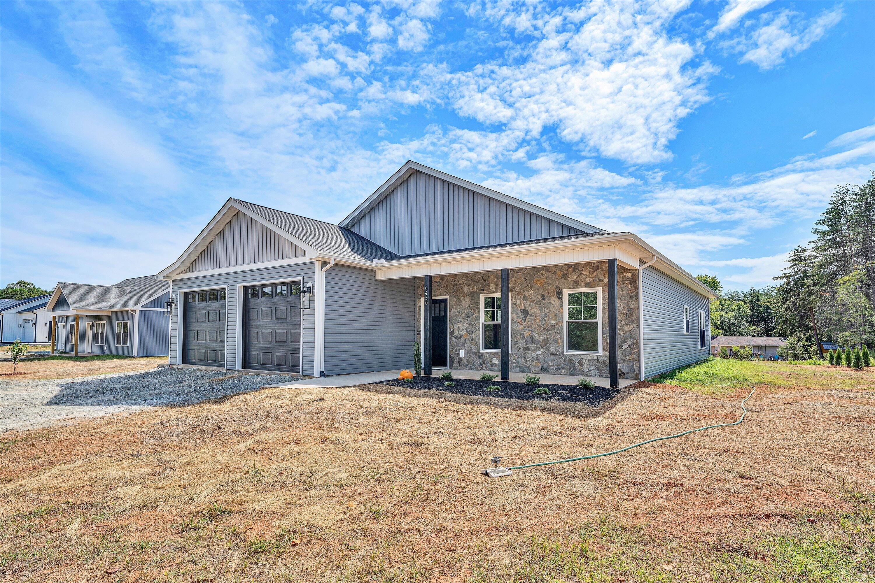 6450 Scruggs Road Moneta, VA 24121 - Photo 4 of 42 a front view of a house with a yard