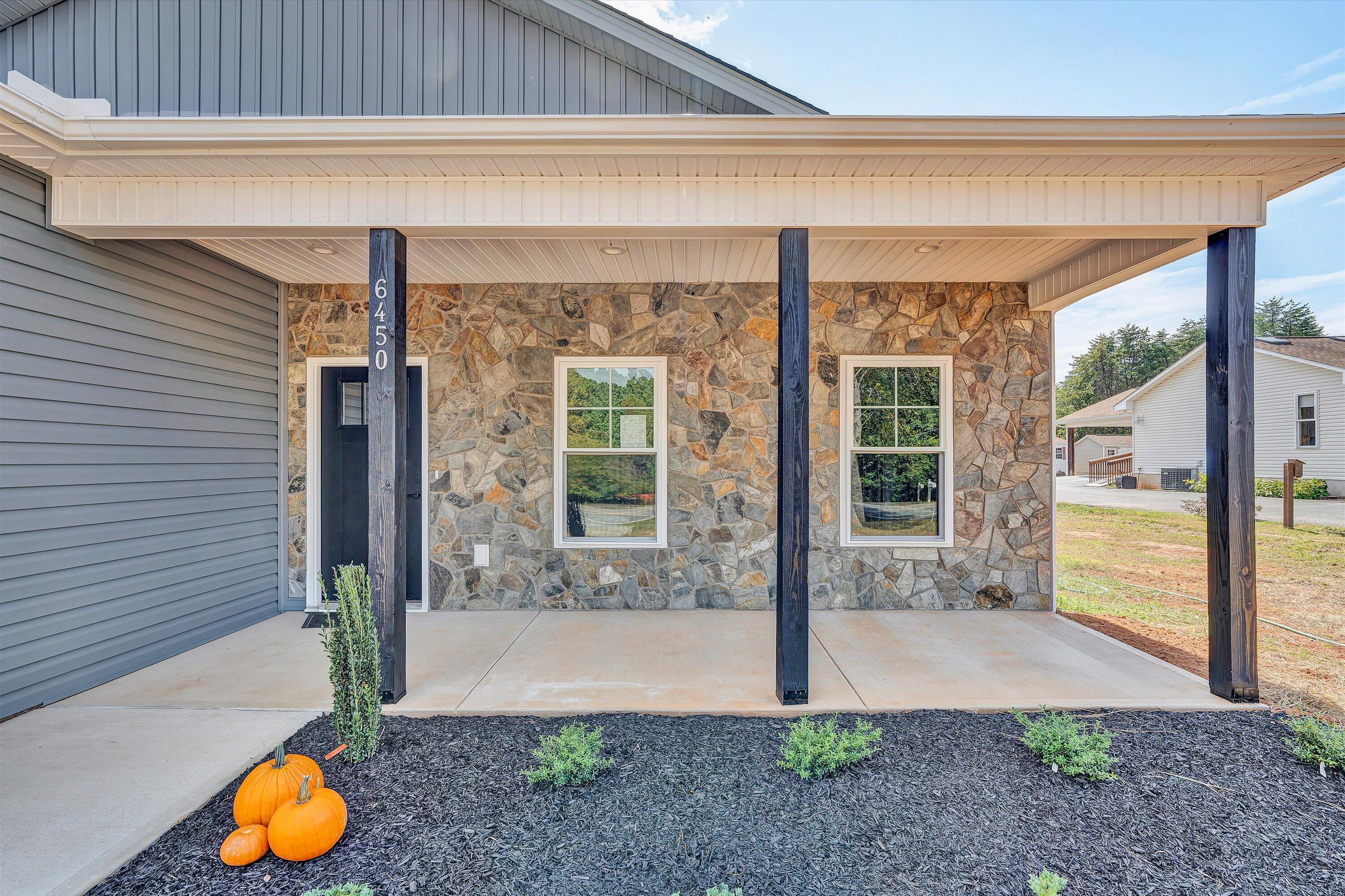 6450 Scruggs Road Moneta, VA 24121 - Photo 6 of 42 a backyard of a house with seating space