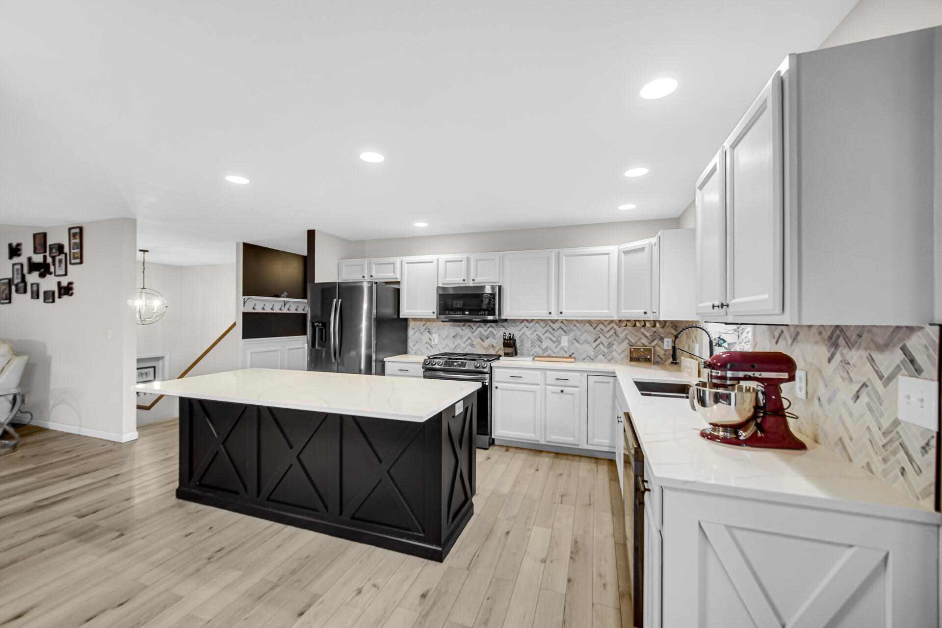 3429 East Sand Ridge Road Rolling Prairie, IN 46371 - Photo 2 of 25 a kitchen with a sink a stove and cabinets