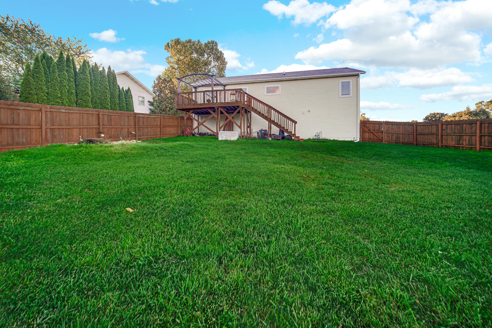 3429 East Sand Ridge Road Rolling Prairie, IN 46371 - Photo 23 of 25 a view of a house with backyard and garden