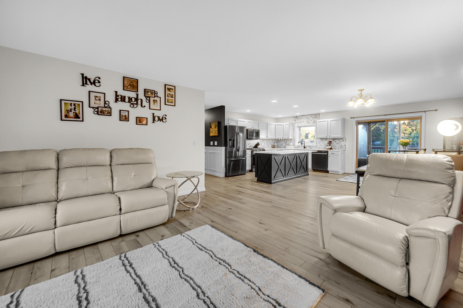 3429 East Sand Ridge Road Rolling Prairie, IN 46371 - Photo 5 of 25 a living room with furniture and view of kitchen