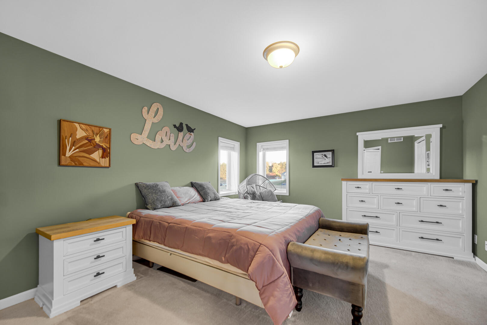 3429 East Sand Ridge Road Rolling Prairie, IN 46371 - Photo 8 of 25 a bedroom with a bed and a dresser