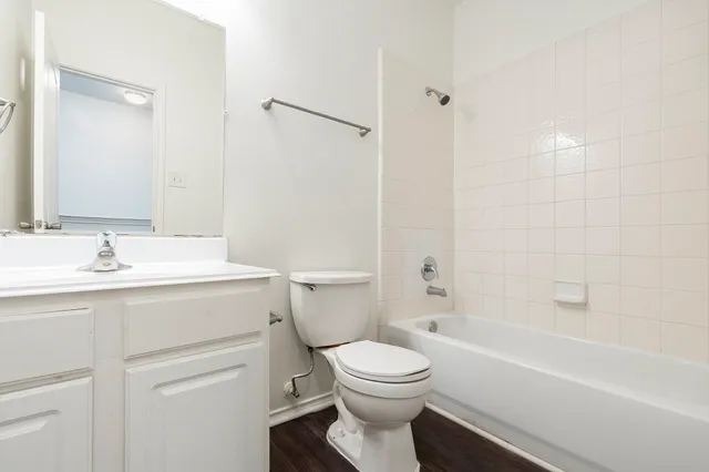 a bathroom with a sink a toilet and a bathtub