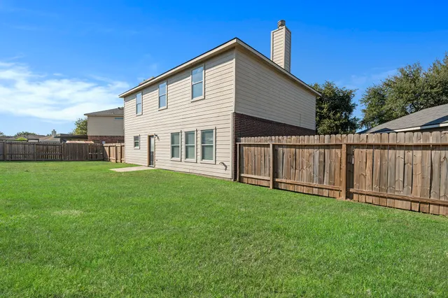 a view of a backyard with a garden