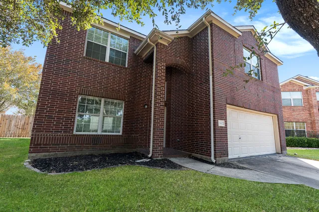 a view of backyard with a barn and a large window