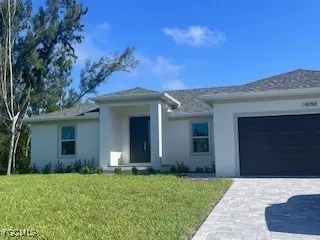 front view of a house with a yard