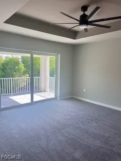 a view of a livingroom with a ceiling fan and window