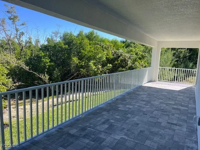 a view of balcony with yard