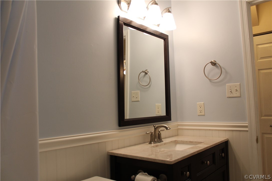 4718 Newbys Bridge Road Chesterfield, VA 23832 - Photo 5 of 15 a bathroom with a sink and a mirror