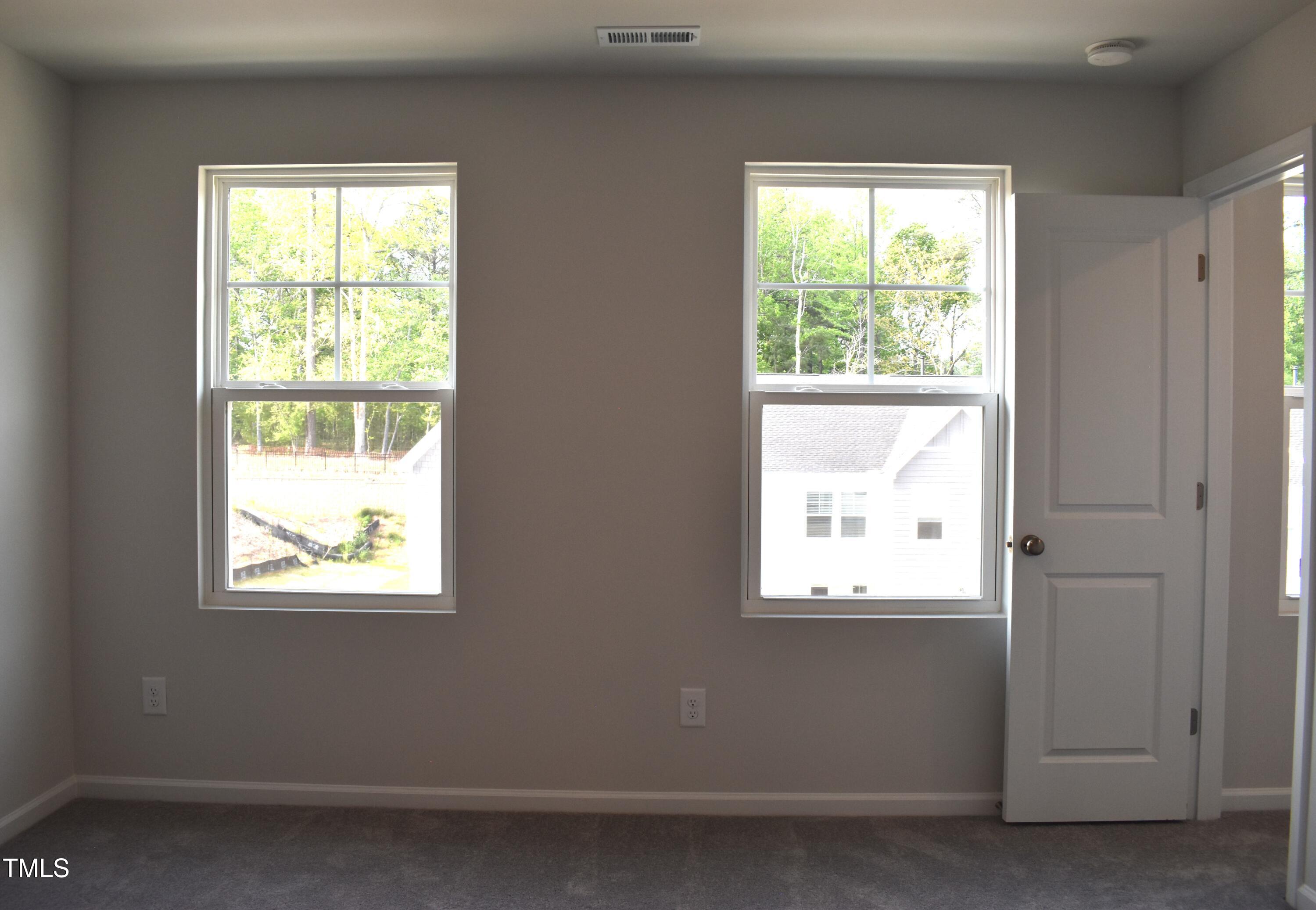 301 Deercroft Drive Apex, NC 27539 - Photo 27 of 33 a view of an empty room with a window