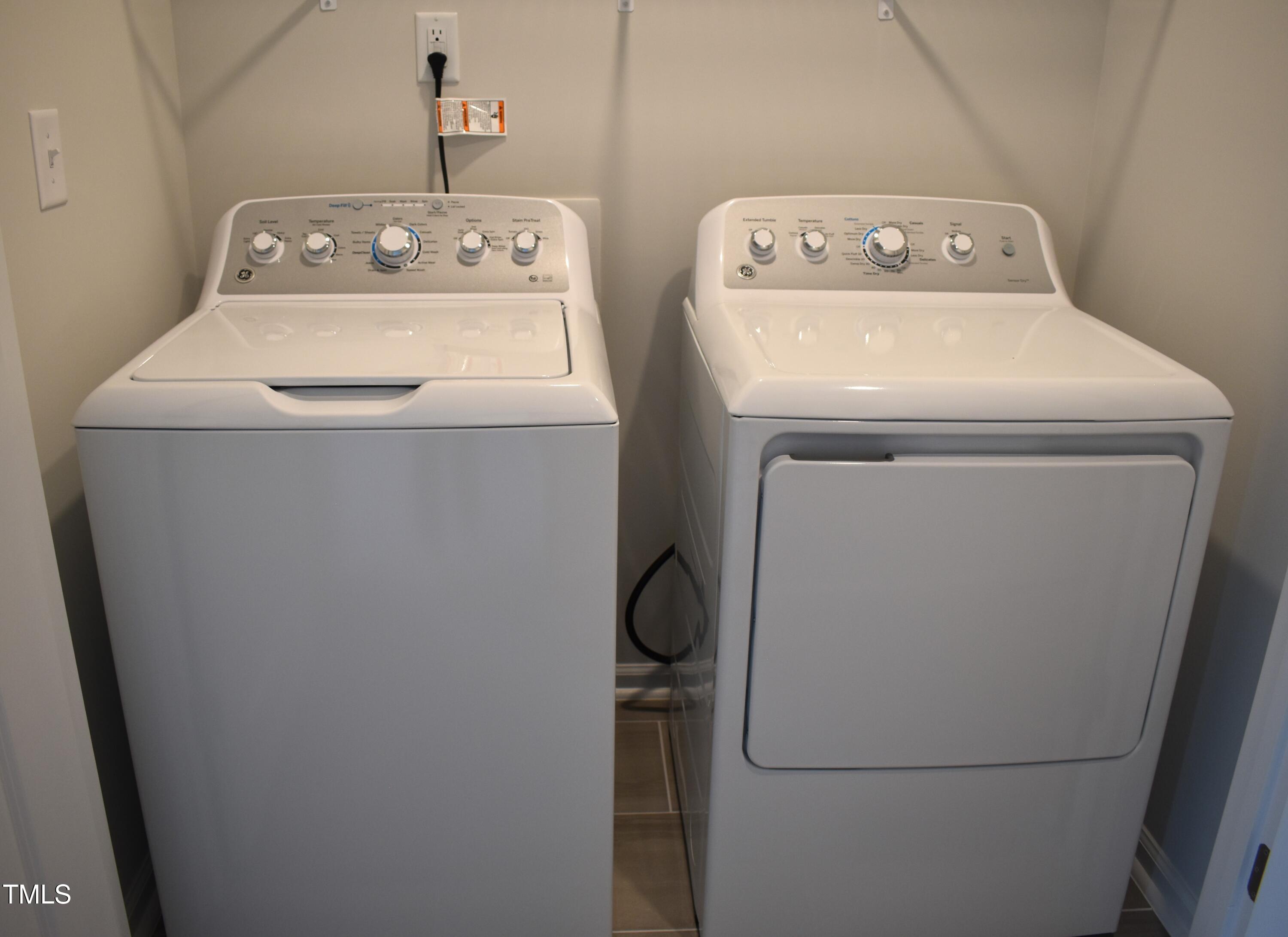 301 Deercroft Drive Apex, NC 27539 - Photo 29 of 33 a utility room with dryer and washer