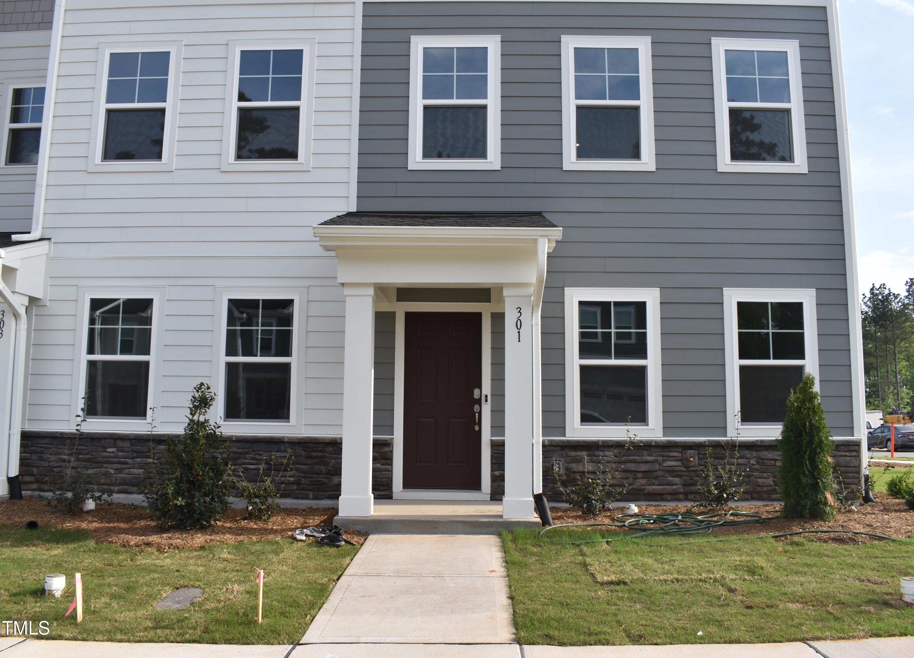 301 Deercroft Drive Apex, NC 27539 - Photo 3 of 33 a front view of a house with a yard