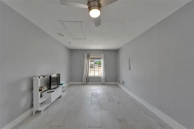 a view of room with window and hardwood floor
