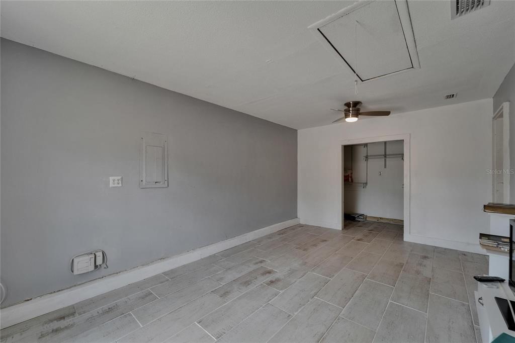 8818 Ashman Road Riverview, FL 33578 - Photo 15 of 26 an empty room with a empty space and windows