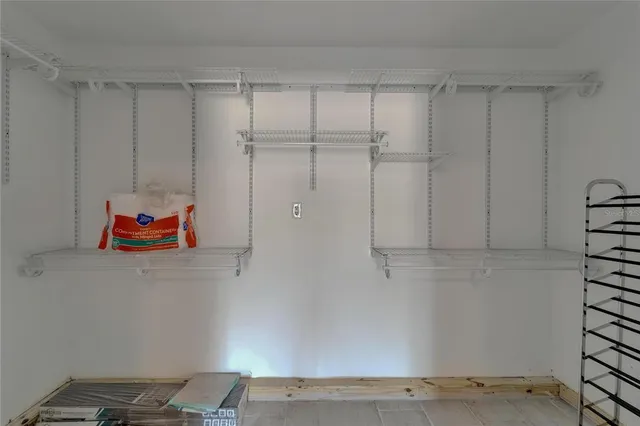 a backyard with white cabinet and a shower