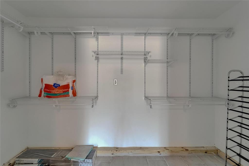 8818 Ashman Road Riverview, FL 33578 - Photo 16 of 26 a backyard with white cabinet and a shower