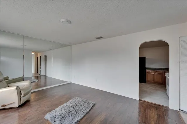 a view of a livingroom with wooden floor