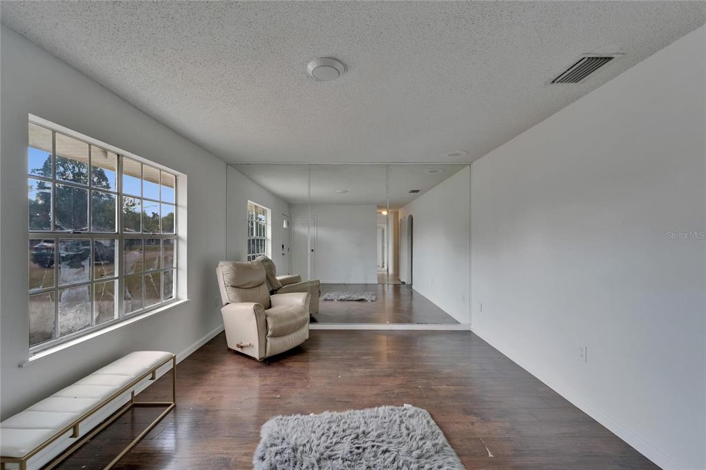 8818 Ashman Road Riverview, FL 33578 - Photo 9 of 26 a living room with furniture and large windows