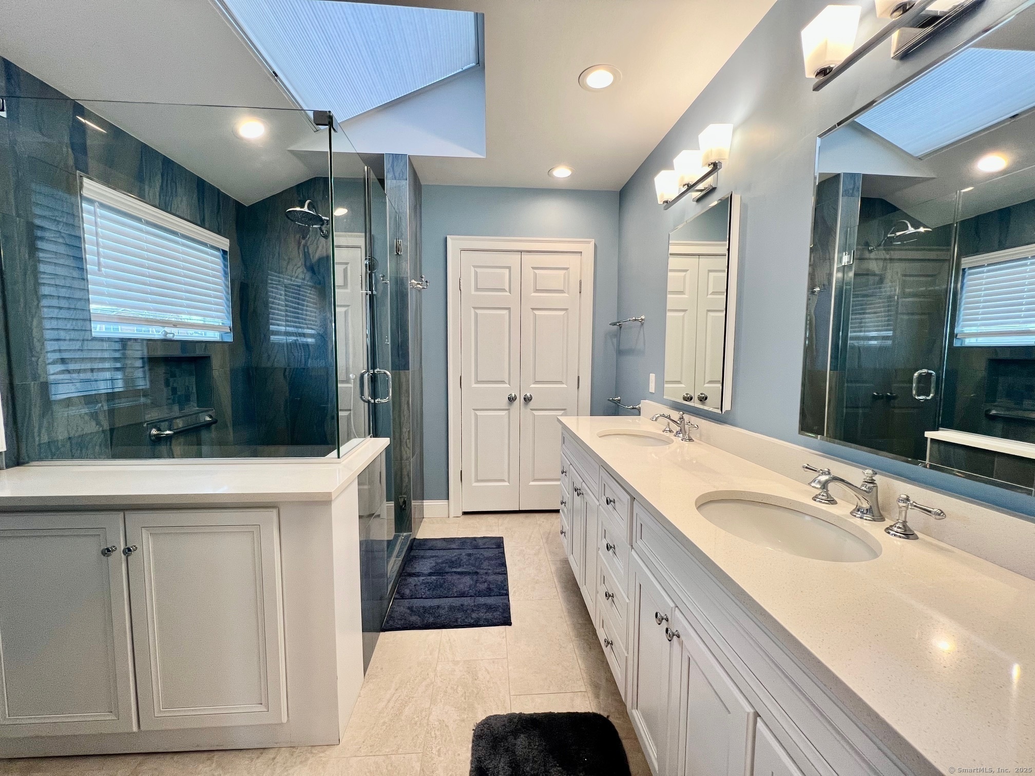 23 Linden Lane Madison, CT 06443 - Photo 18 of 30 Primary Bathroom is classically remodeled with walk-in shower and two sinks.