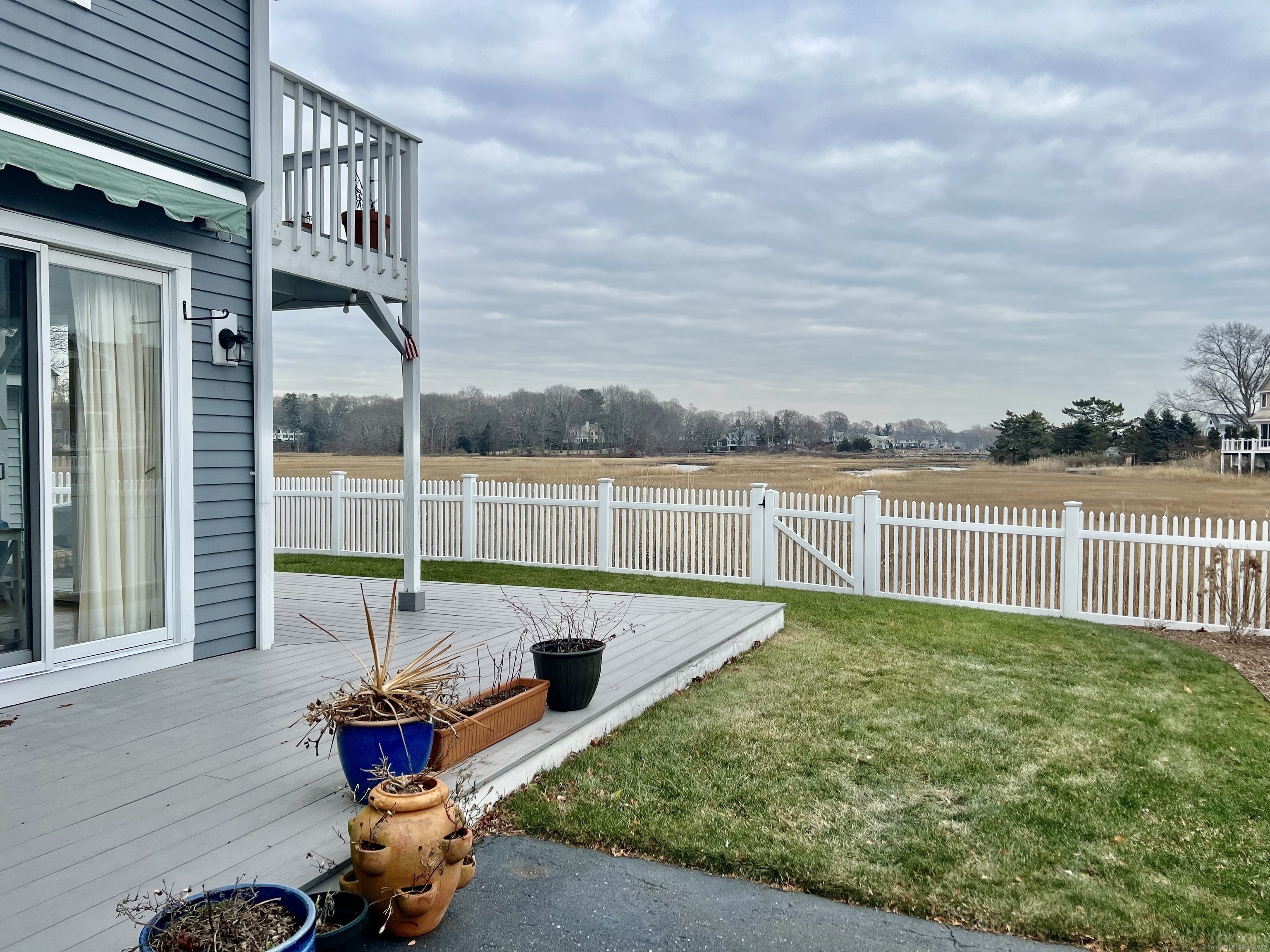 23 Linden Lane Madison, CT 06443 - Photo 21 of 30 Rear yard with wrap deck for outdoor entertaining.