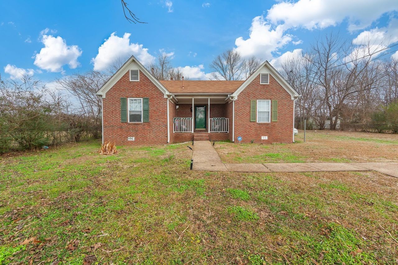 203 South Fairgrounds Street Jackson, TN 38301 - Photo 11 of 13 a front view of a house with yard