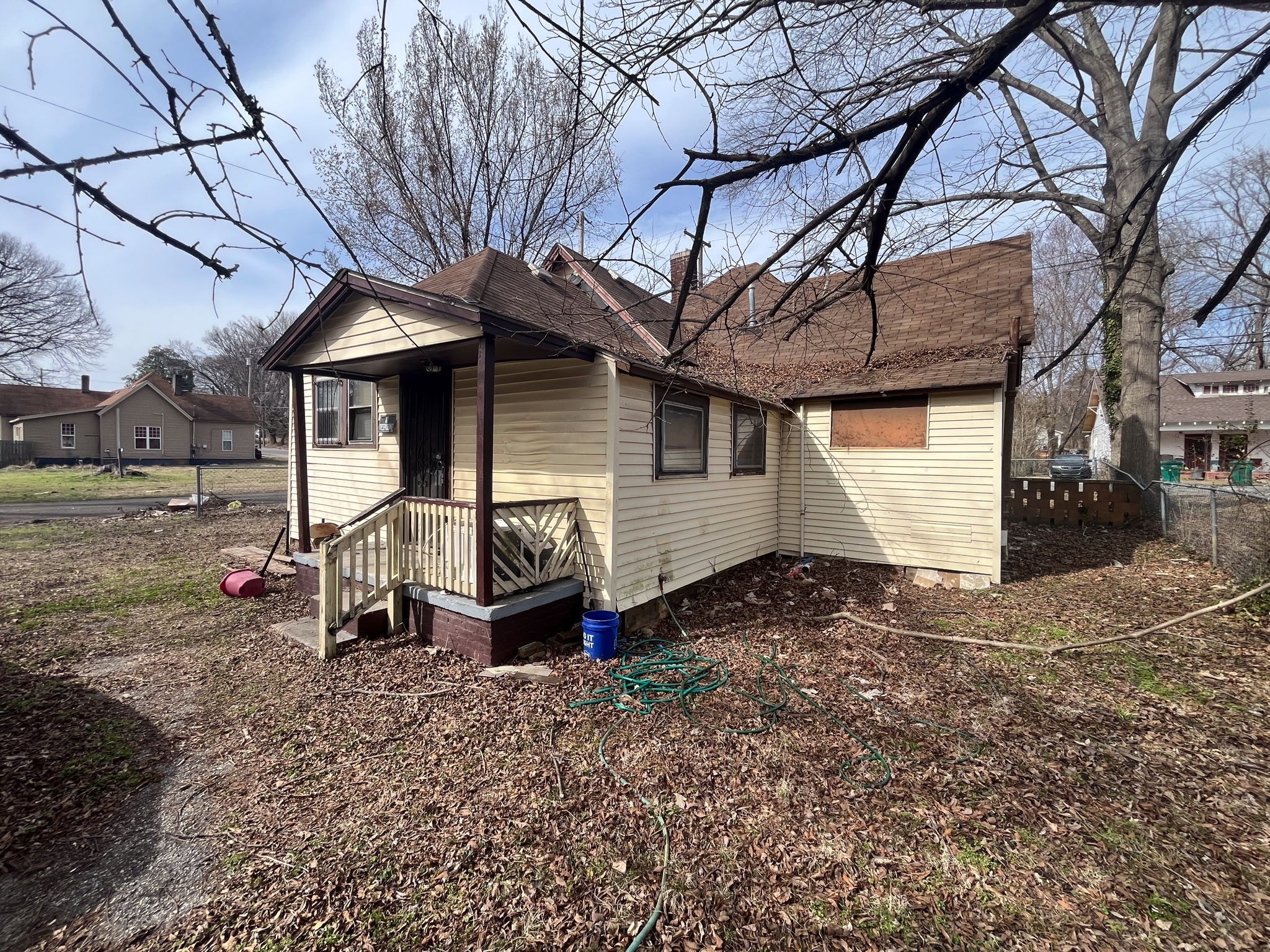 203 South Fairgrounds Street Jackson, TN 38301 - Photo 6 of 13 a view of a house with a backyard and chairs