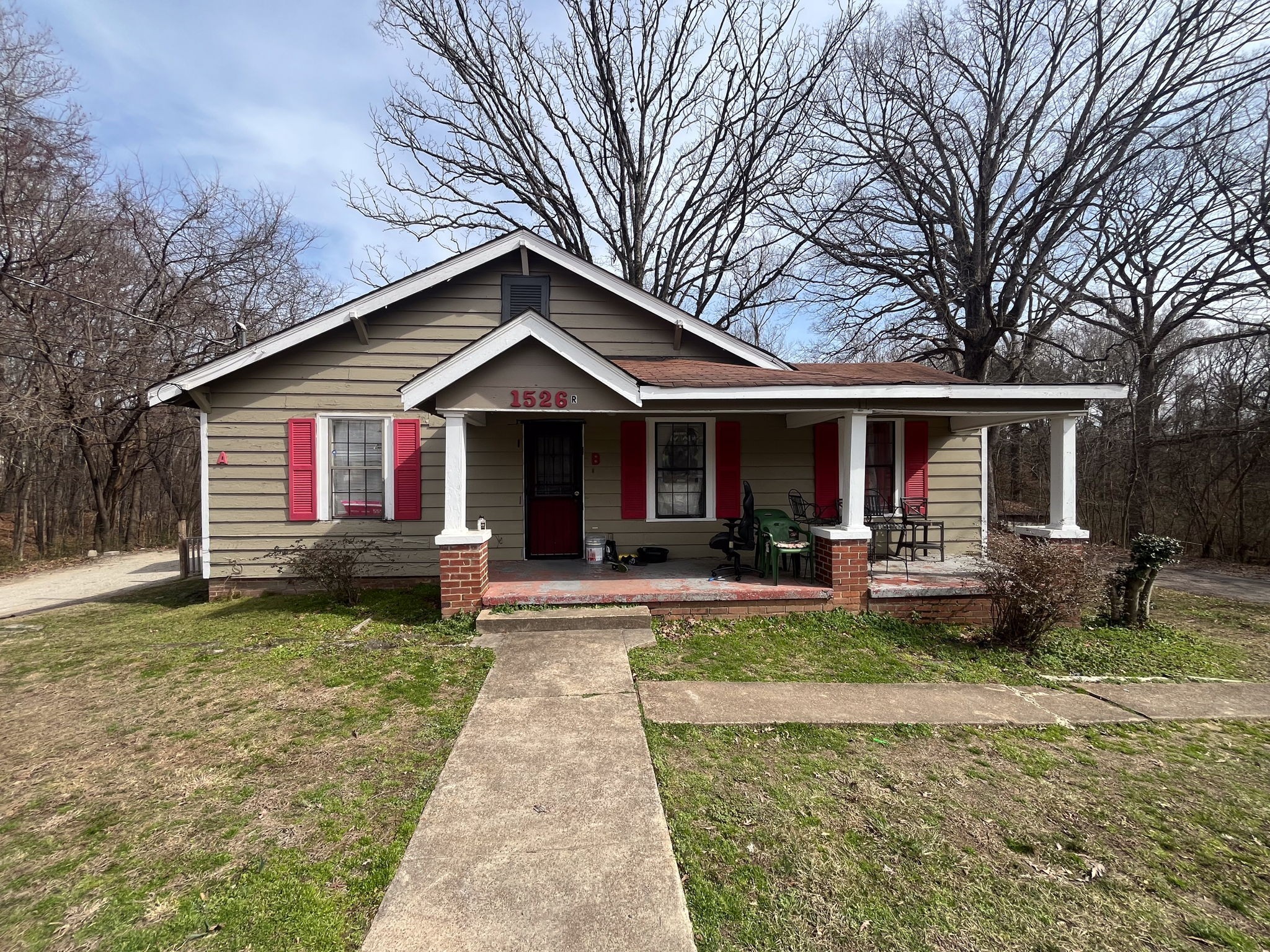 203 South Fairgrounds Street Jackson, TN 38301 - Photo 7 of 13 a front view of a house with yard and green space