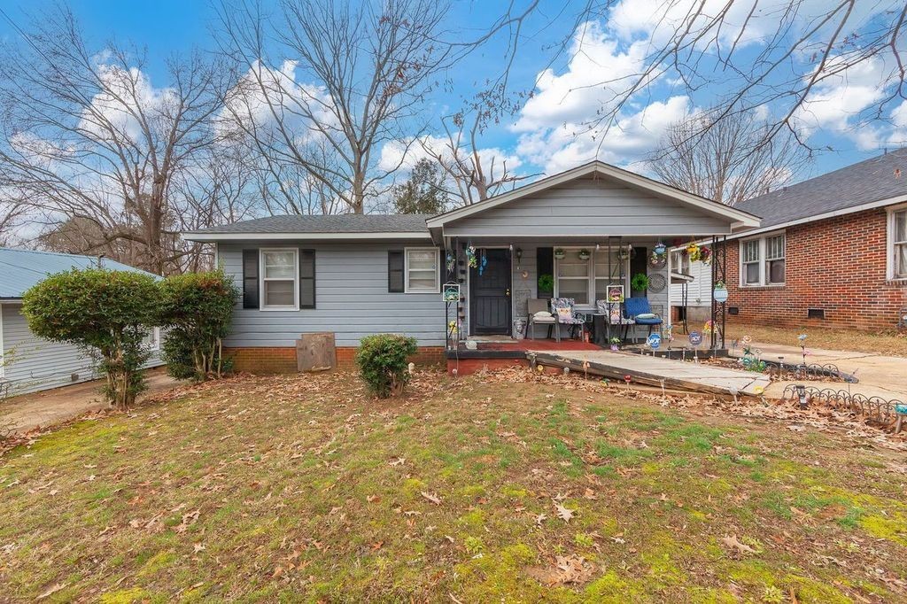 203 South Fairgrounds Street Jackson, TN 38301 - Photo 8 of 13 a view of a house with pool and chairs