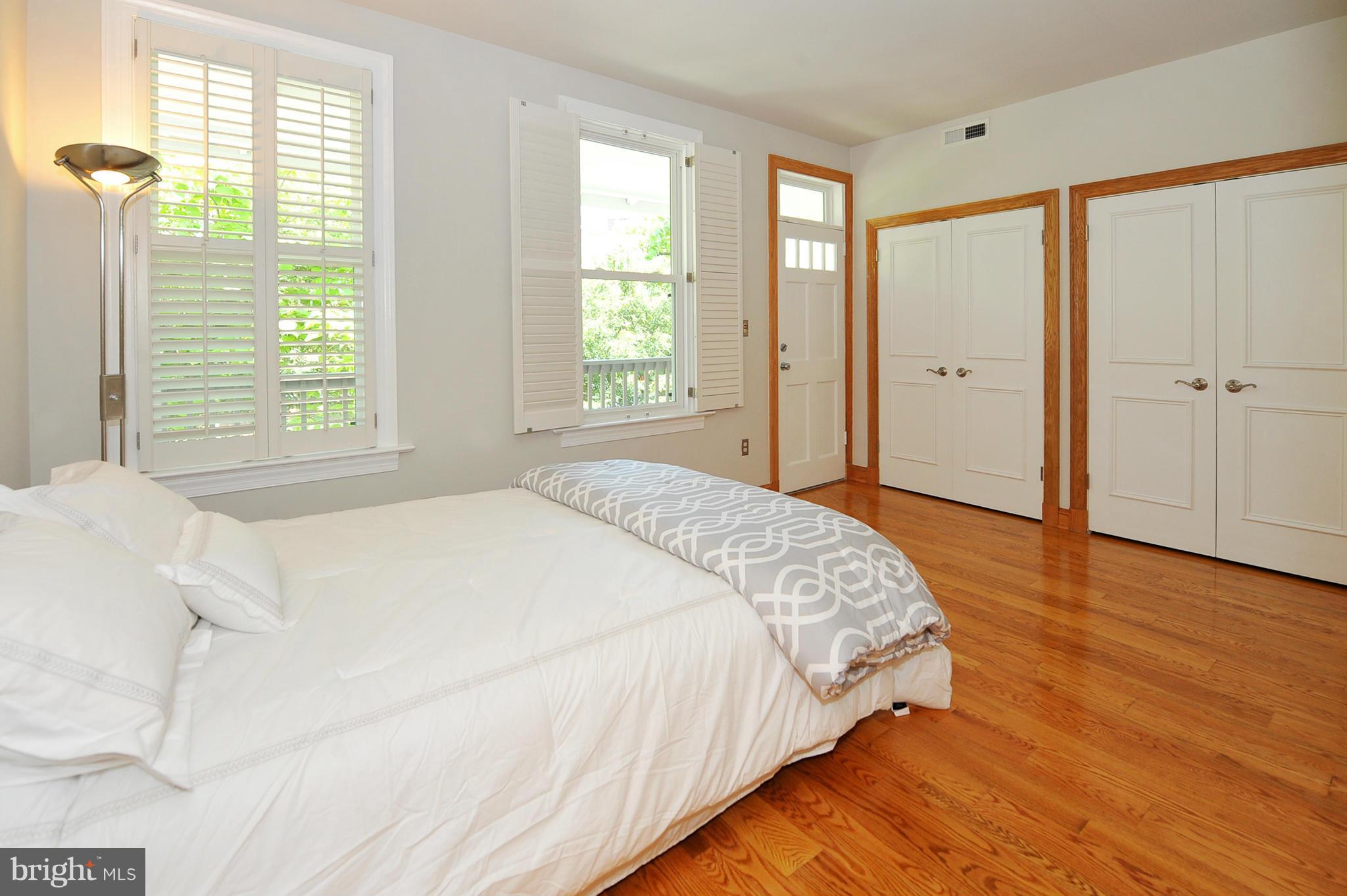 2509 17th Street Northwest, Unit 3 Washington, DC 20009 - Photo 11 of 27 a spacious bedroom with a bed and a window