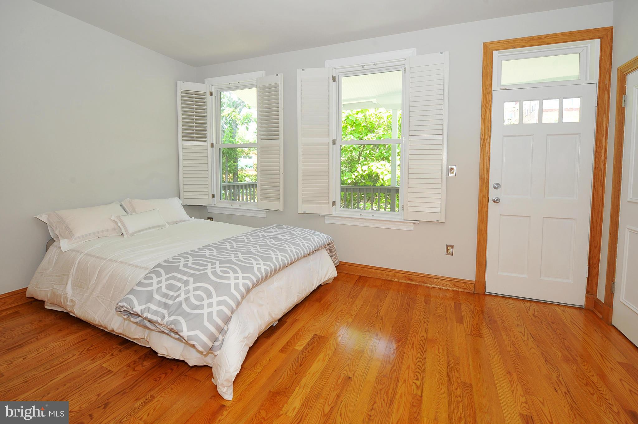 2509 17th Street Northwest, Unit 3 Washington, DC 20009 - Photo 12 of 27 a bedroom with a bed and a window