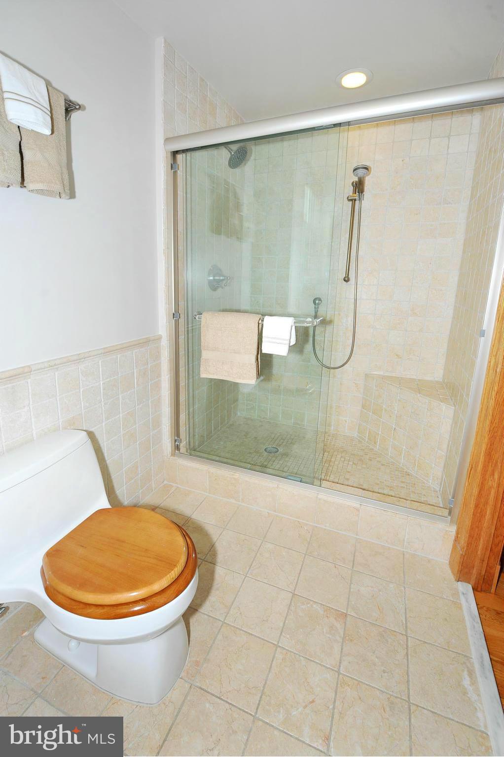 2509 17th Street Northwest, Unit 3 Washington, DC 20009 - Photo 15 of 27 a bathroom with a sink mirror vanity and toilet