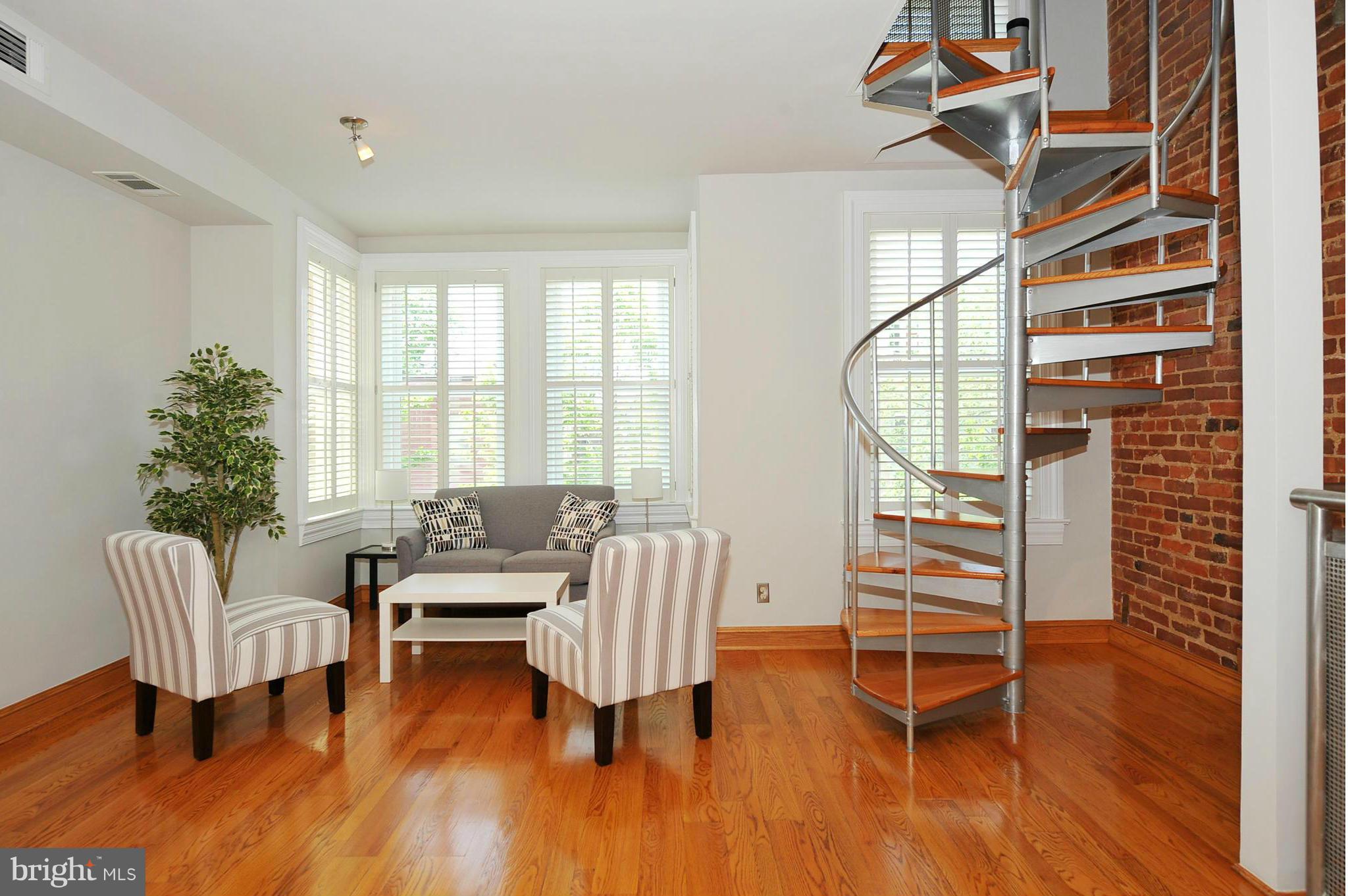 2509 17th Street Northwest, Unit 3 Washington, DC 20009 - Photo 6 of 27 a living room with furniture and a large window