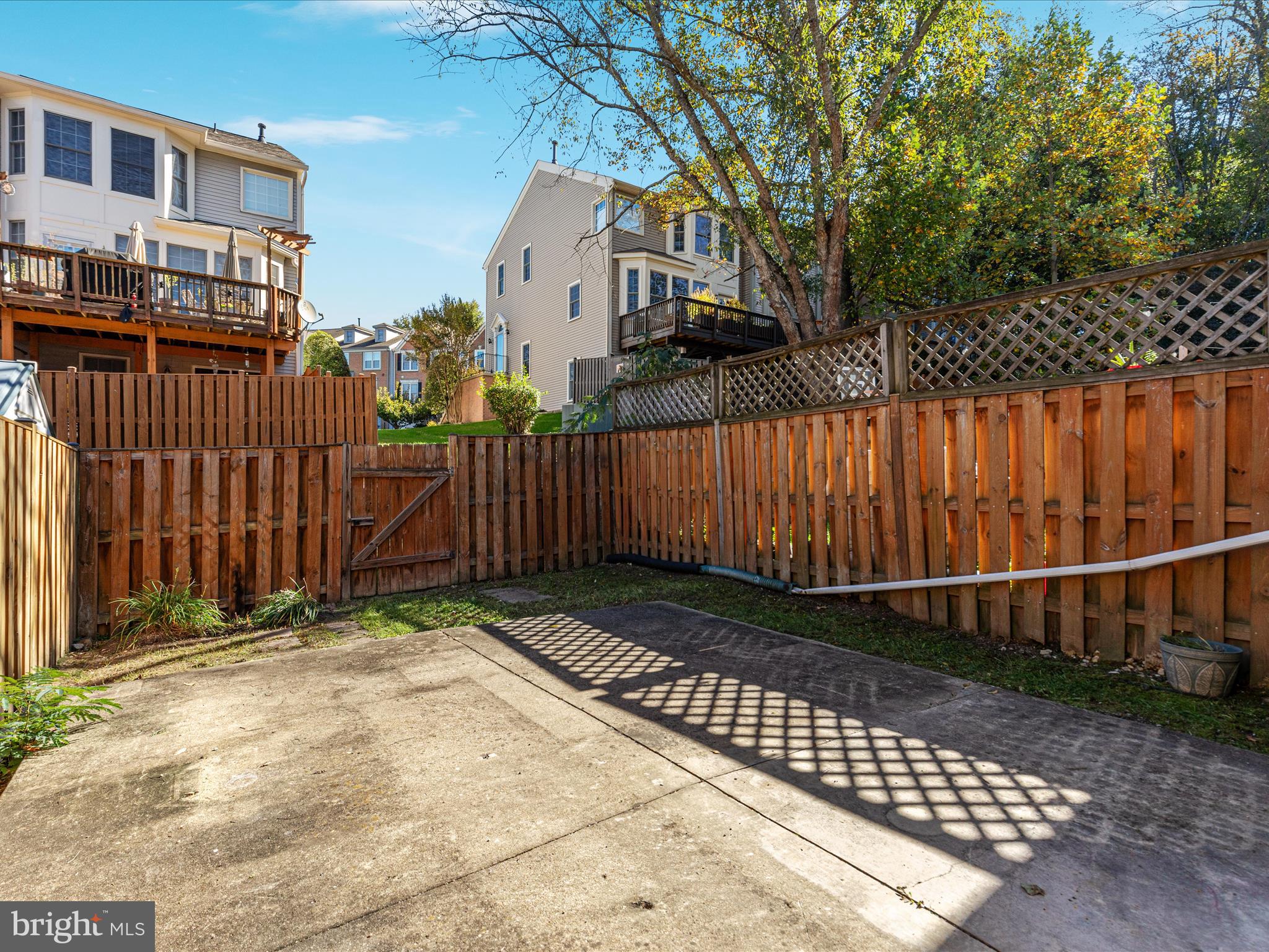 7219 Kousa Lane Springfield, VA 22152 - Photo 23 of 34 a view of a house with a wooden fence