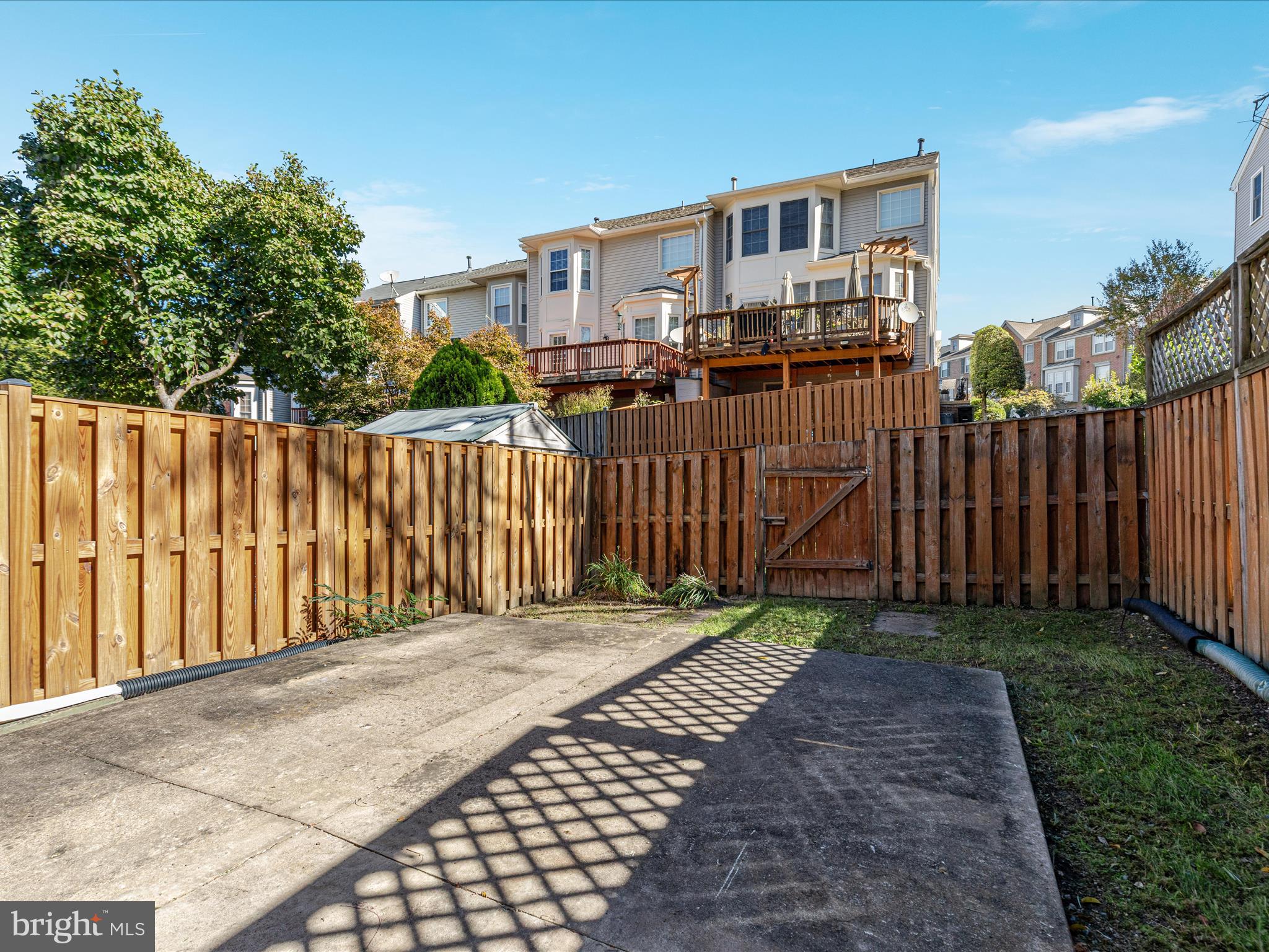 7219 Kousa Lane Springfield, VA 22152 - Photo 24 of 34 a front view of a house with a wooden fence