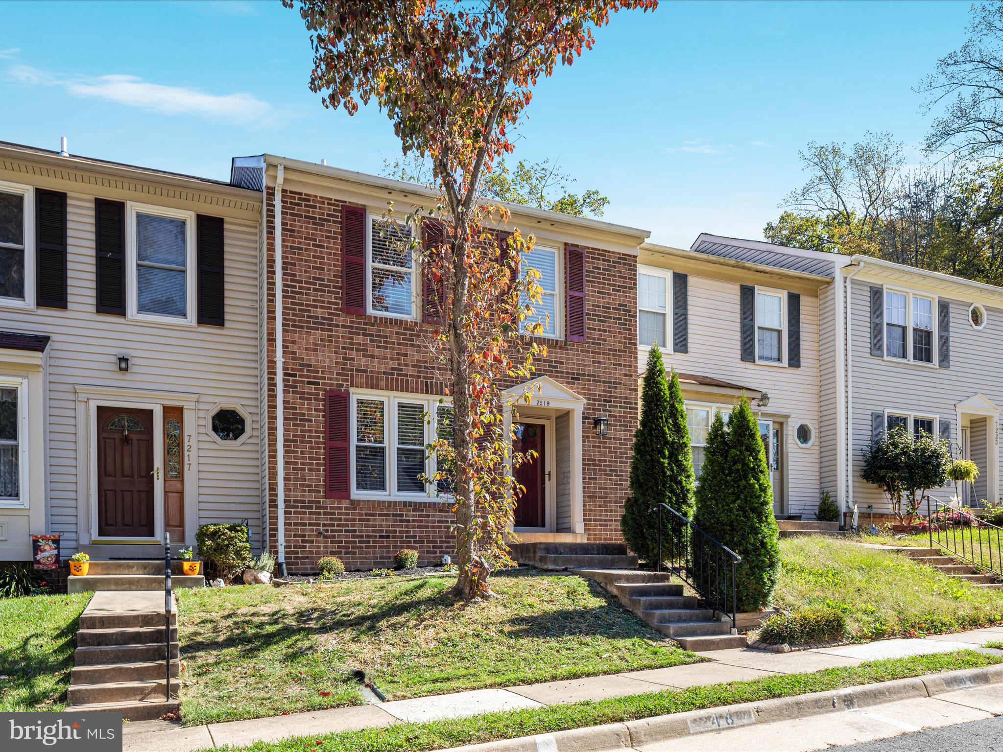 7219 Kousa Lane Springfield, VA 22152 - Photo 25 of 34 a front view of a house with garden