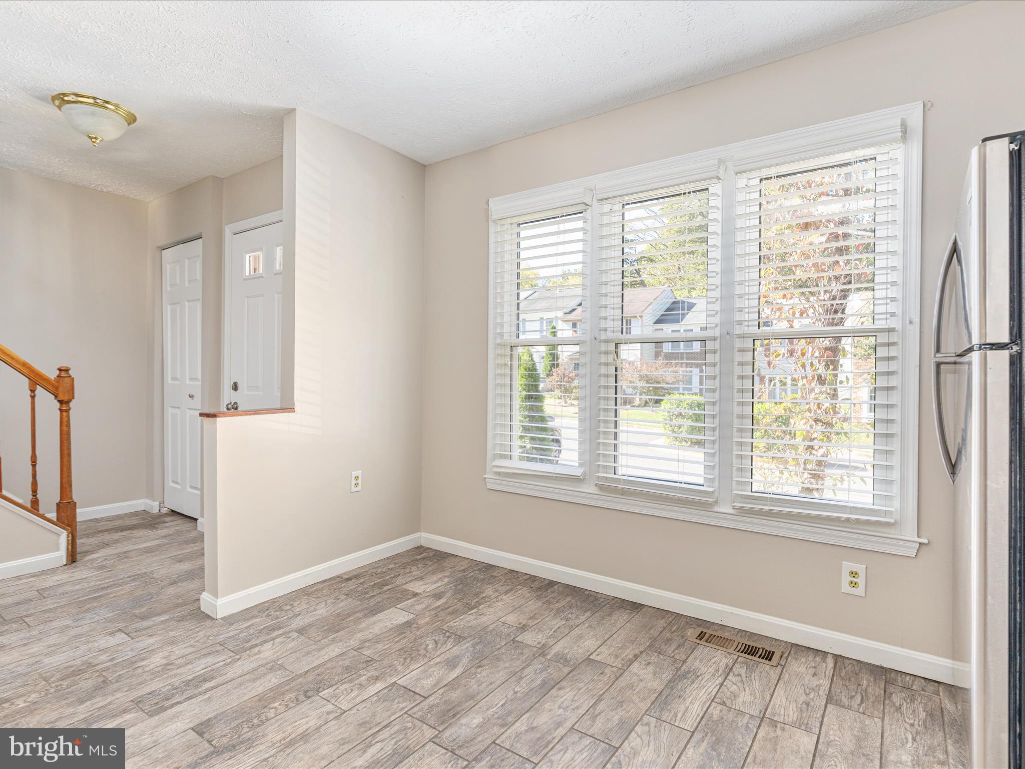 7219 Kousa Lane Springfield, VA 22152 - Photo 7 of 34 a view of an empty room with a window