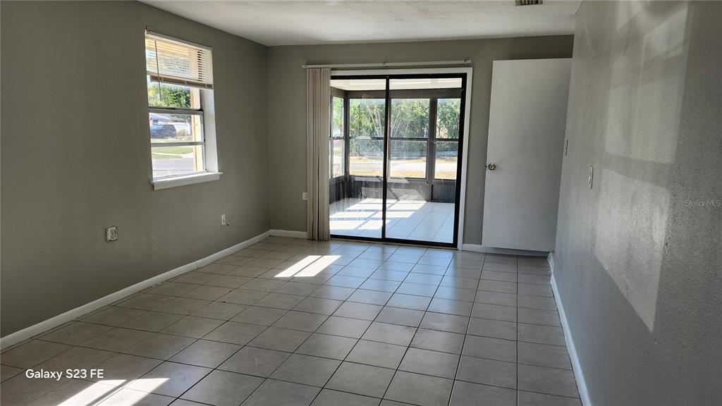 5507 Riddle Road Holiday, FL 34690 - Photo 7 of 18 an empty room with windows