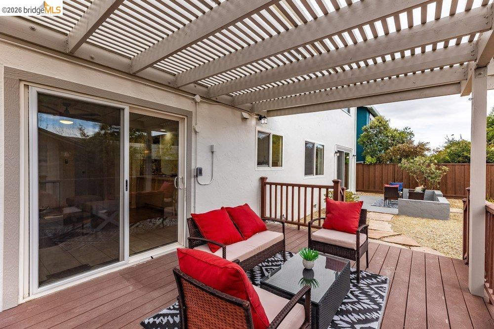 1298 Ribbon Street Foster City, CA 94404 - Photo 72 of 86 Expansive outdoor deck featuring a slat patio cover, wood-finish decking, and direct access to the interior via sliding glass doors