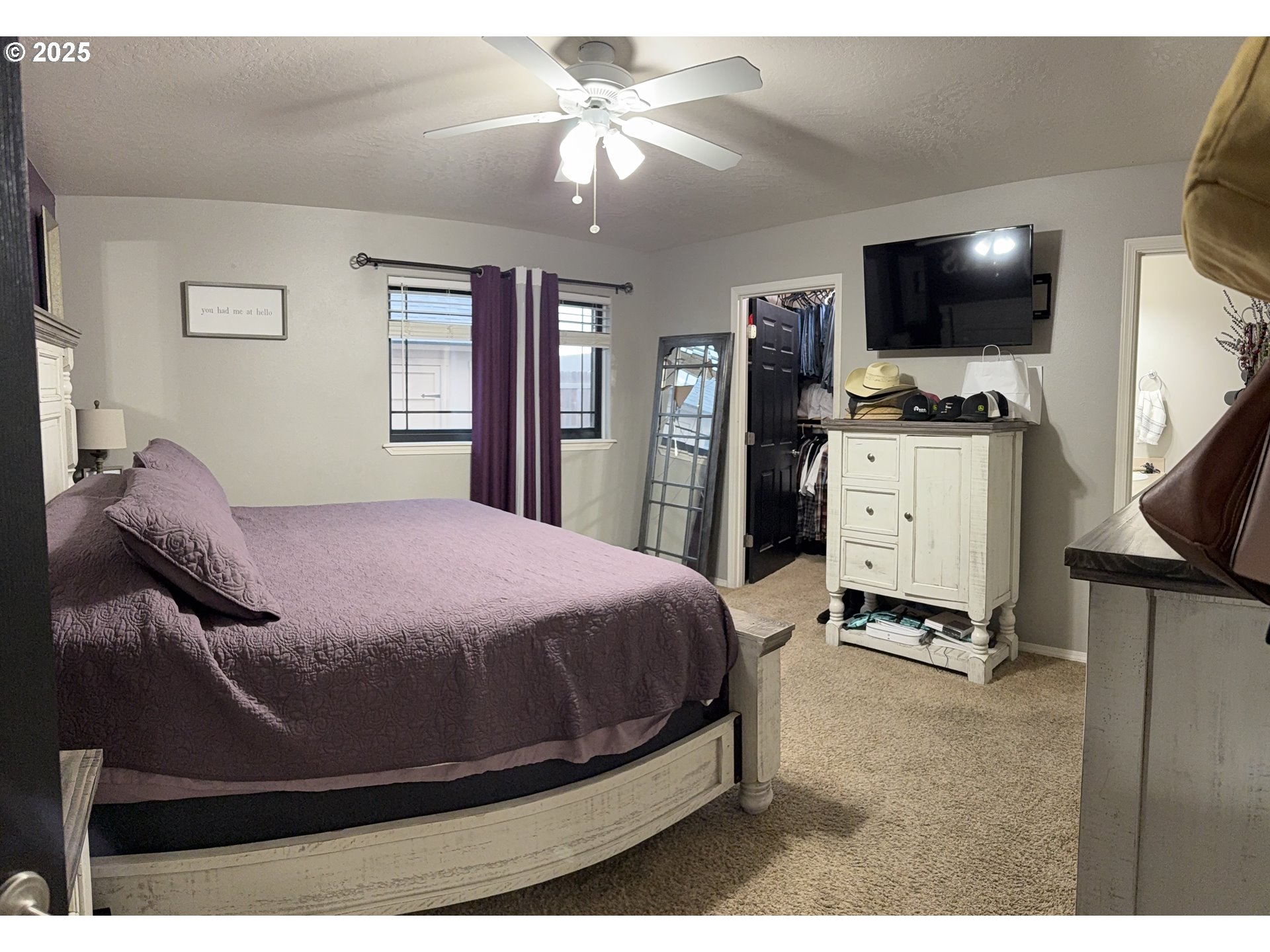 717 West Pheasant Avenue Hermiston, OR 97838 - Photo 13 of 17 a bedroom with a bed and a flat screen tv