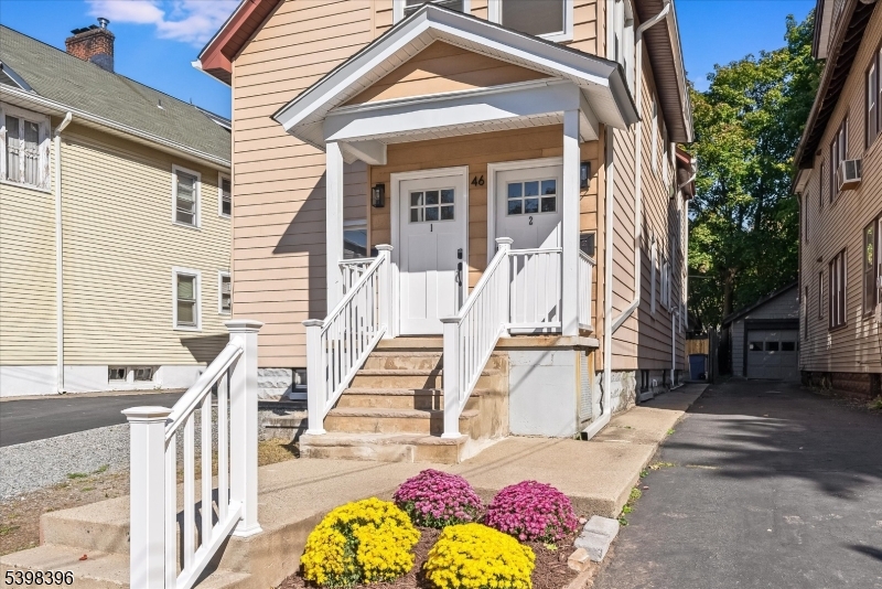 46 James Street, Unit 2 Montclair, NJ 07042 - Photo 1 of 22 a view of a large building with wooden floor and fence