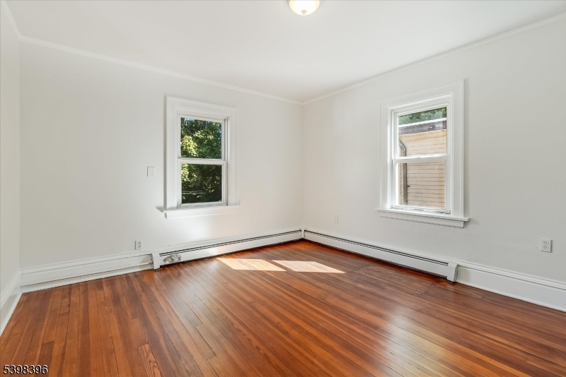 46 James Street, Unit 2 Montclair, NJ 07042 - Photo 12 of 22 a view of a room with wooden floors and window