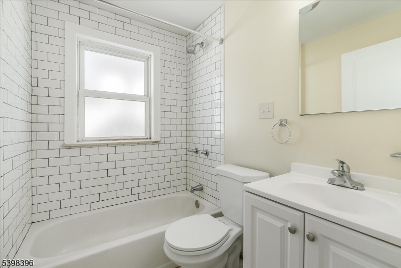 46 James Street, Unit 2 Montclair, NJ 07042 - Photo 13 of 22 a bathroom with a sink a toilet and shower