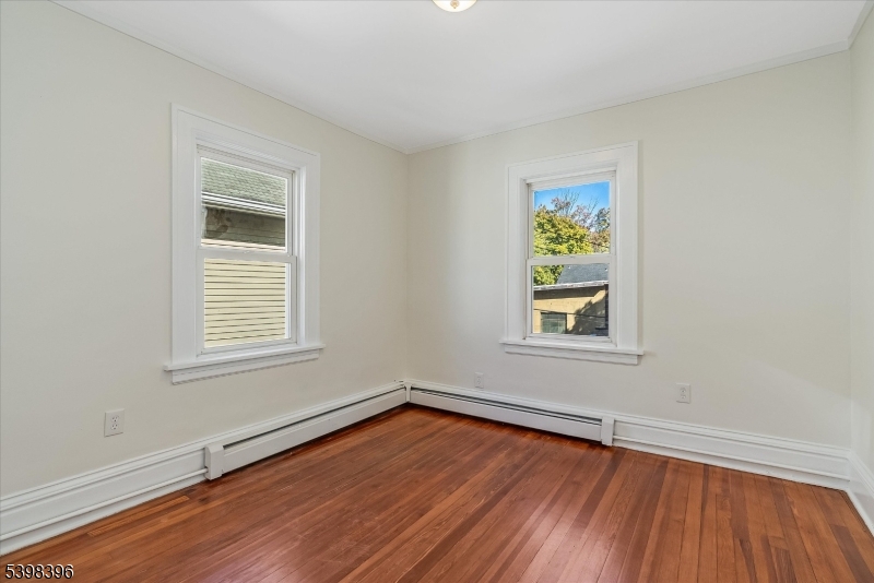 46 James Street, Unit 2 Montclair, NJ 07042 - Photo 14 of 22 wooden floor in an empty room with a window