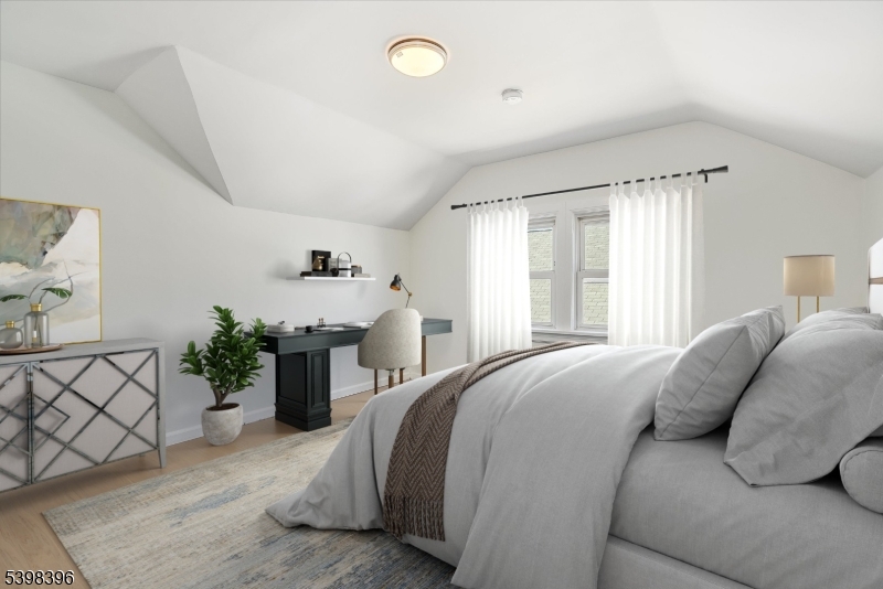 46 James Street, Unit 2 Montclair, NJ 07042 - Photo 18 of 22 a spacious bedroom with a bed and a couch