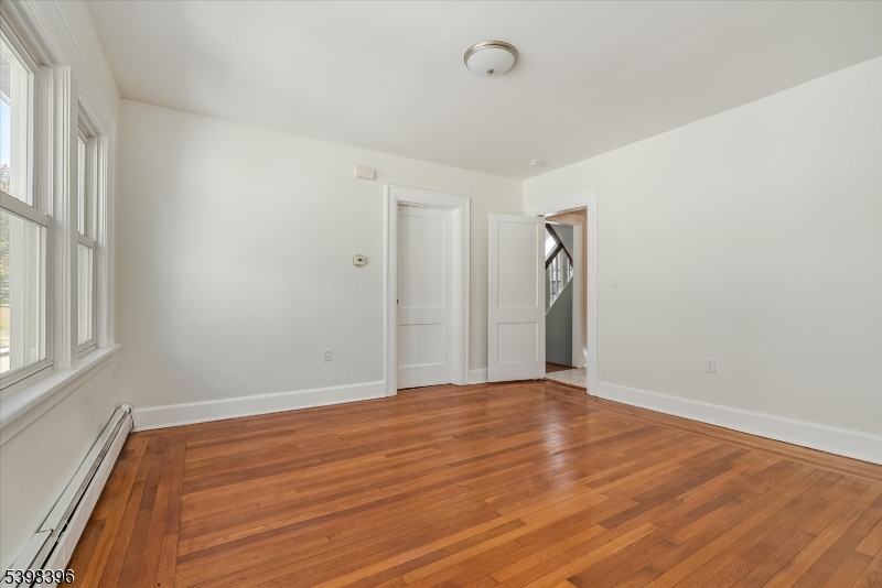 46 James Street, Unit 2 Montclair, NJ 07042 - Photo 9 of 22 an empty room with wooden floor and windows