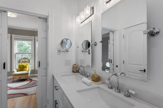 a bathroom with a sink double vanity and a mirror